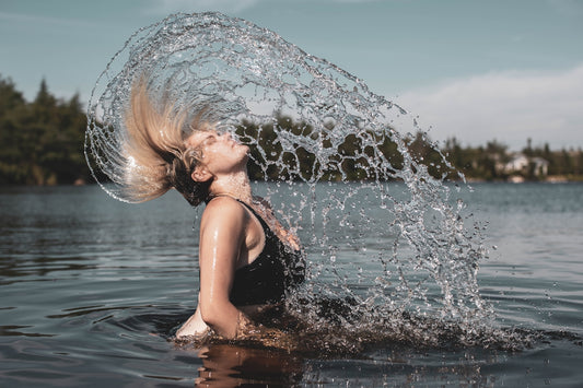 woman in black tank top on water