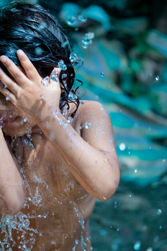 woman in water with water droplets