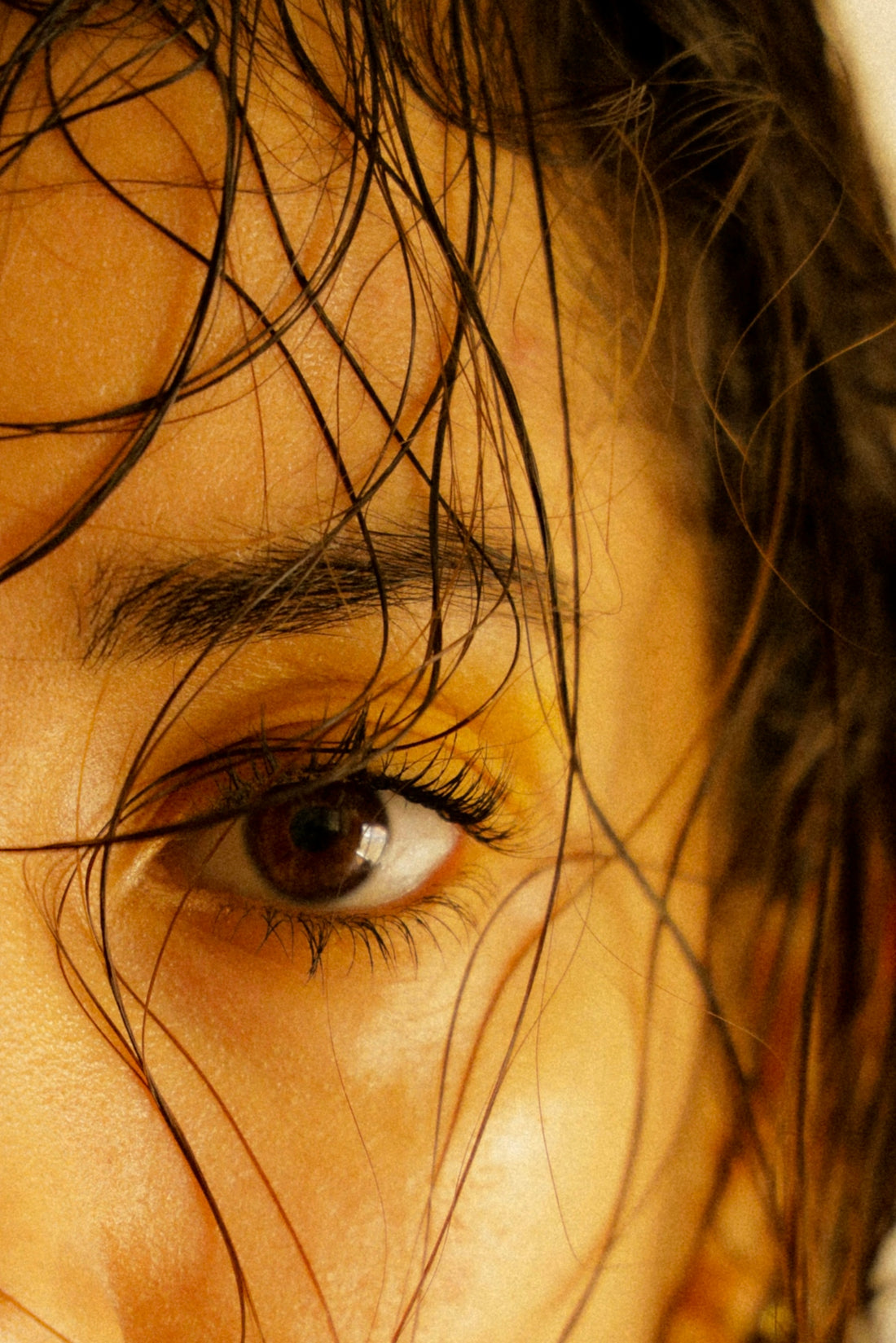 a close up of a person with wet hair