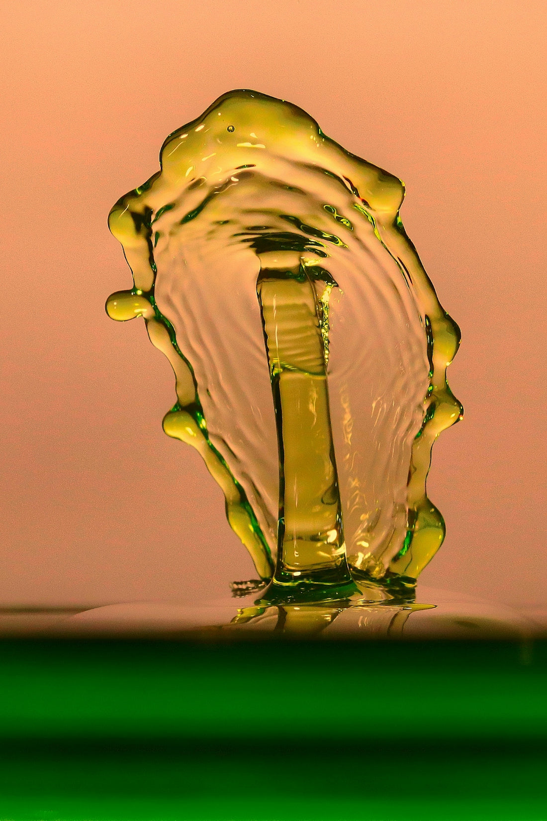a drop of water that is falling into the water