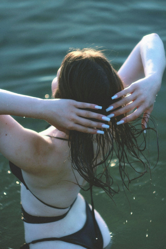 A woman in a bikini in the water