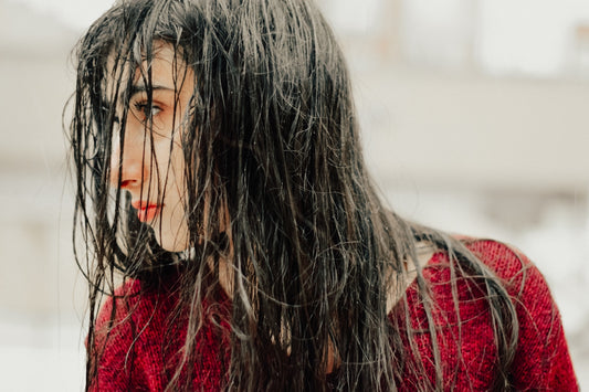A close up of a woman with wet hair