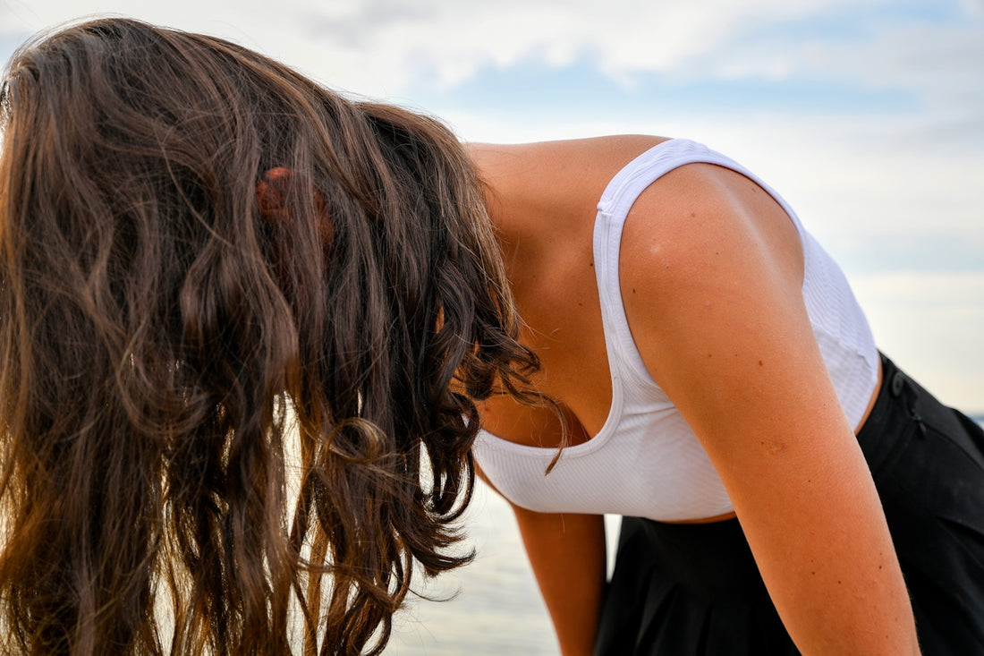 Young woman with long brown hair outdoors